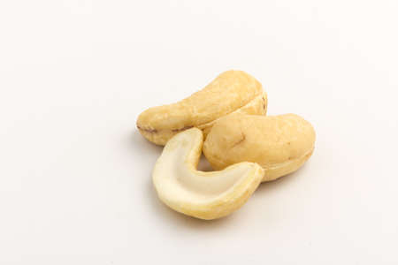 Raw cashew nuts isolated on white background. Package design element with clipping pathの写真素材