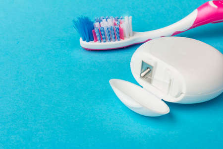 Dental floss dispenser for oral hygiene. Teeth cleaning tool background image.の写真素材