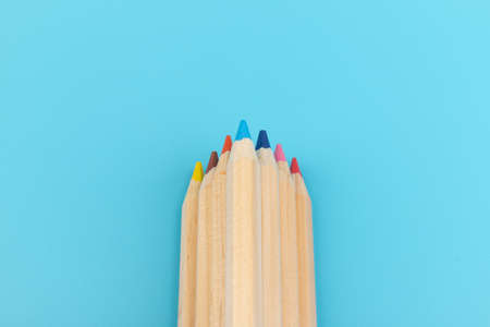 Colour pencils on blue background. Back to school. Education conceptの写真素材