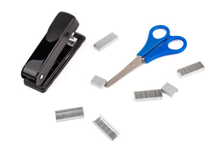 Close up stack of metal staples for stapler on a white background