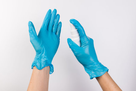 Hand sanitizer in gloved hand closeup. Call for hand disinfection. Stop coronavirus concept banner....