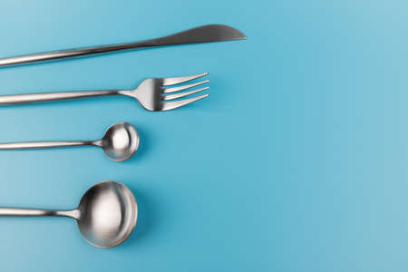 fork, knife, spoon, cutlery on blue background.の写真素材