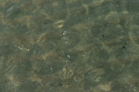 Sea waves. Transparent clear sea. Top view. Close-up. Background. Texture.