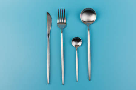 fork, knife, spoon, cutlery on blue background.の写真素材
