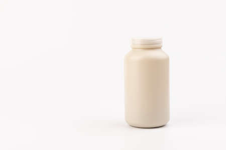 Pills jar. Medical container for drugs, diet, nutritional supplements on light background.の写真素材
