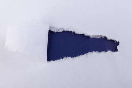 Torn Paper with space for text with a purple background. Ripped paper. Concept of placing text or othe elements, copy space, mockup.の写真素材