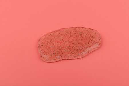 Glitter slime dripping on pink background. Transparent toy. Glossy texture with girly colors of...
