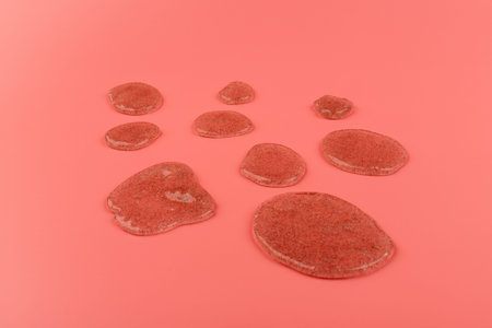 Glitter slime dripping on pink background. Transparent toy. Glossy texture with girly colors of...