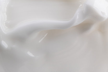cream background. Cosmetics. Cream white background texture.