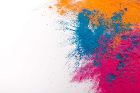 abstract spray powder background. Colorful powder explosion on white background. A colored cloud. Colorful dust explosions. Holi paint.の写真素材
