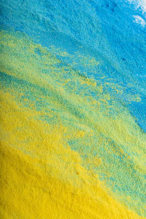 Ukrainian flag colors. Blue and yellow background from holi powder paint.の写真素材