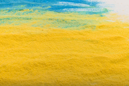 Ukrainian flag colors. Blue and yellow background from holi powder paint.の写真素材
