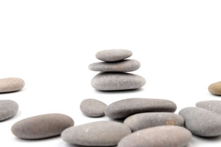 Pile of stones isolated on white background. zen / spa stones studio isolated.の写真素材