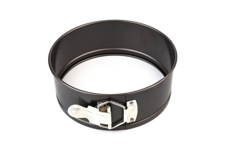 op view on new black collapsible stainless steel round cooking empty pan for cupcakes isolated on...