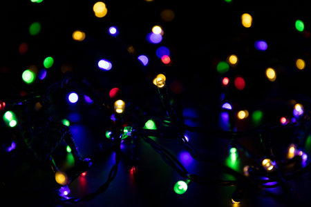 Abstract colorful christmas light. Bokeh background whith de focused lights and copy space.