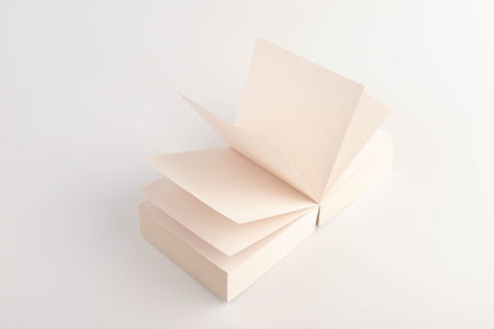 Small gray book open with blank pages. Blank Sticker notes on the white background. sticky Note Paper. Empty sheets for notes.の写真素材