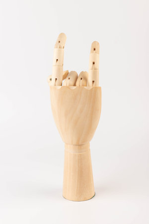 Wooden hand of mannequin on white backgroundの写真素材