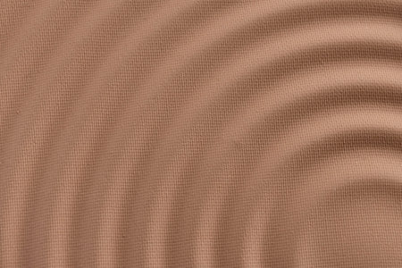 Texture of powder for makeup in macro, abstract background. Wavy pattern. Brown pastel waves. textured plaster. close upの写真素材