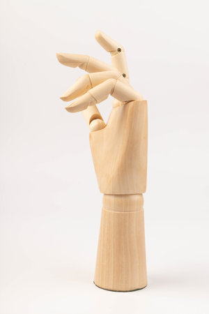 Wooden hand of mannequin on white backgroundの写真素材