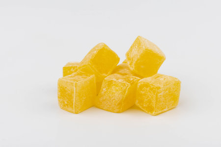 Traditional Turkish delight isolated on white background. Sweet delicious lukum color.の写真素材