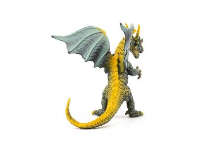 Beautiful and cool green and yellow dragon toy, isolated on white backgroundの写真素材