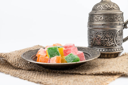 Turkish delight on metal plate isolated on white backgroundの写真素材