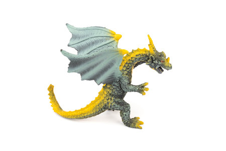 Beautiful and cool green and yellow dragon toy, isolated on white backgroundの写真素材