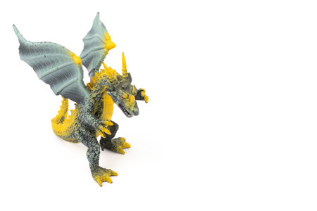 Beautiful and cool green and yellow dragon toy, isolated on white backgroundの写真素材
