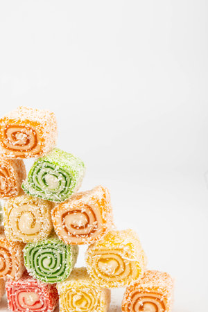 Traditional Turkish delight isolated on white background. Sweet delicious lukum colorの写真素材