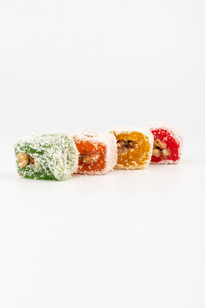 Traditional Turkish delight isolated on white background. Sweet delicious lukum colorの写真素材