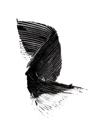 Smudged black mascara on white background. Cosmetic product swatch. Paint brush strokeの写真素材