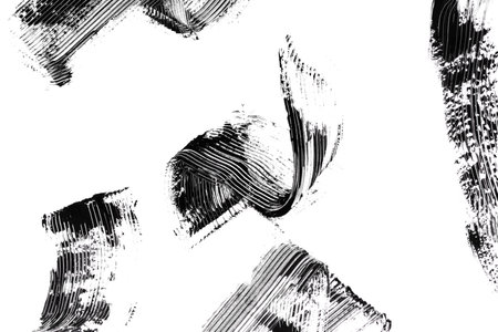 Smudged black mascara on white background. Cosmetic product swatch. Paint brush strokeの写真素材