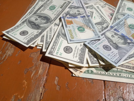 dollars on an old shabby floor, poverty and wealth concept