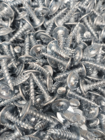 Screws piled up together as a background. Close up.の写真素材