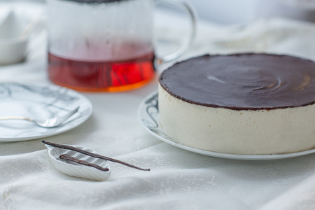 white souffle cake bird's milk with dark icingの写真素材