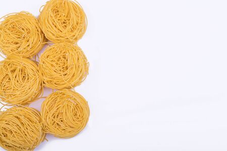 Italian egg pasta nest isolated on white background, flat lay, mock upの写真素材