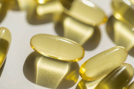 capsules of fish fat oil vitamin for heart, omega 3, macroの写真素材