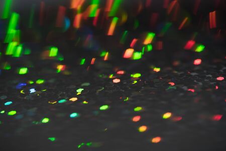 Sparkling Glitter abstract background red saturated color ,de-focused, macro.の写真素材