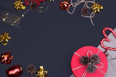 Red round gift box on black background, new year and Christmas gift wrapping . top viewの写真素材