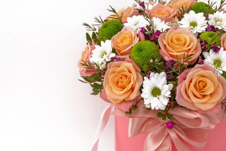 Beautiful bouquet in a pink luxury present box, isolated on white backgroundの写真素材