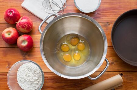 Baking concept . outumn cookies ingredients.Baking pastry and cookies: apples, spices, sugar, eggs on woodの写真素材
