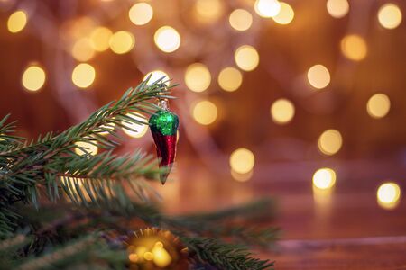 Tree branches, cones, bokeh lights, candles. Christmas balls. Preparation for the New year and Christmasの写真素材