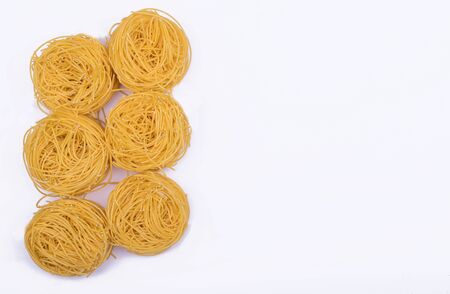 Italian egg pasta nest isolated on white background. Copy space, mock upの写真素材