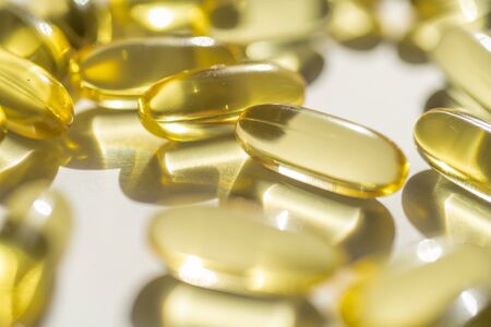 capsules of fish fat oil vitamin for heart, omega 3, macroの写真素材