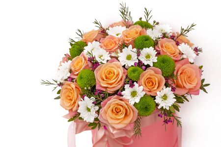 Beautiful bouquet in a pink luxury present box, isolated on white backgroundの写真素材
