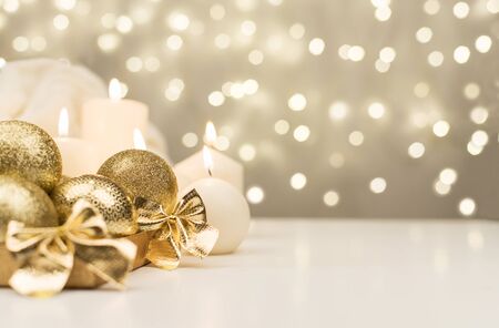 golden christmas ball on golden star bokeh backgroundの写真素材