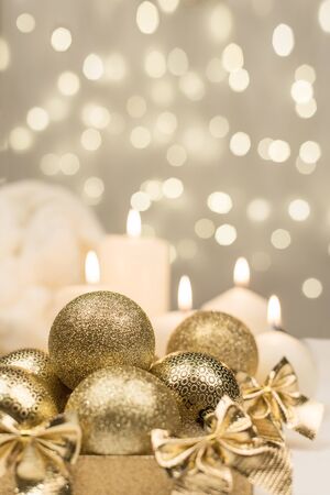 golden christmas ball on golden star bokeh backgroundの写真素材