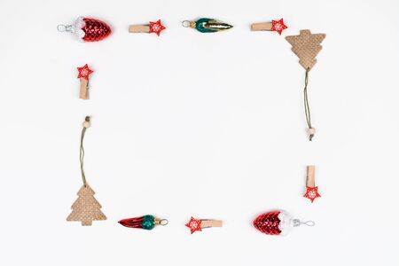 Christmas composition square frame of toys and decor on a white backgroundFlat lay, top view, copy space.の写真素材