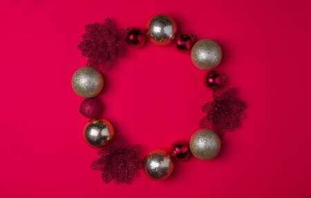 Red and gold Christmas balls on red background, top view, mock upの写真素材