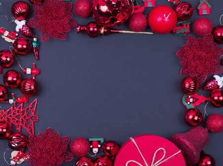 Red and gold Christmas balls on black background, top view, mock upの写真素材